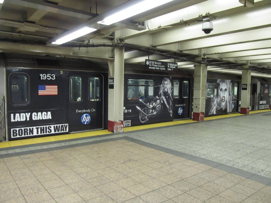 (112k, 1024x768)<br><b>Country:</b> United States<br><b>City:</b> New York<br><b>System:</b> New York City Transit<br><b>Line:</b> IRT Times Square-Grand Central Shuttle<br><b>Location:</b> Grand Central<br><b>Route:</b> S<br><b>Car:</b> R-62A (Bombardier, 1984-1987) 1953 <br><b>Photo by:</b> Robbie Rosenfeld<br><b>Date:</b> 6/13/2011<br><b>Notes:</b> Lady Gaga ad wrap.<br><b>Viewed (this week/total):</b> 1 / 1881