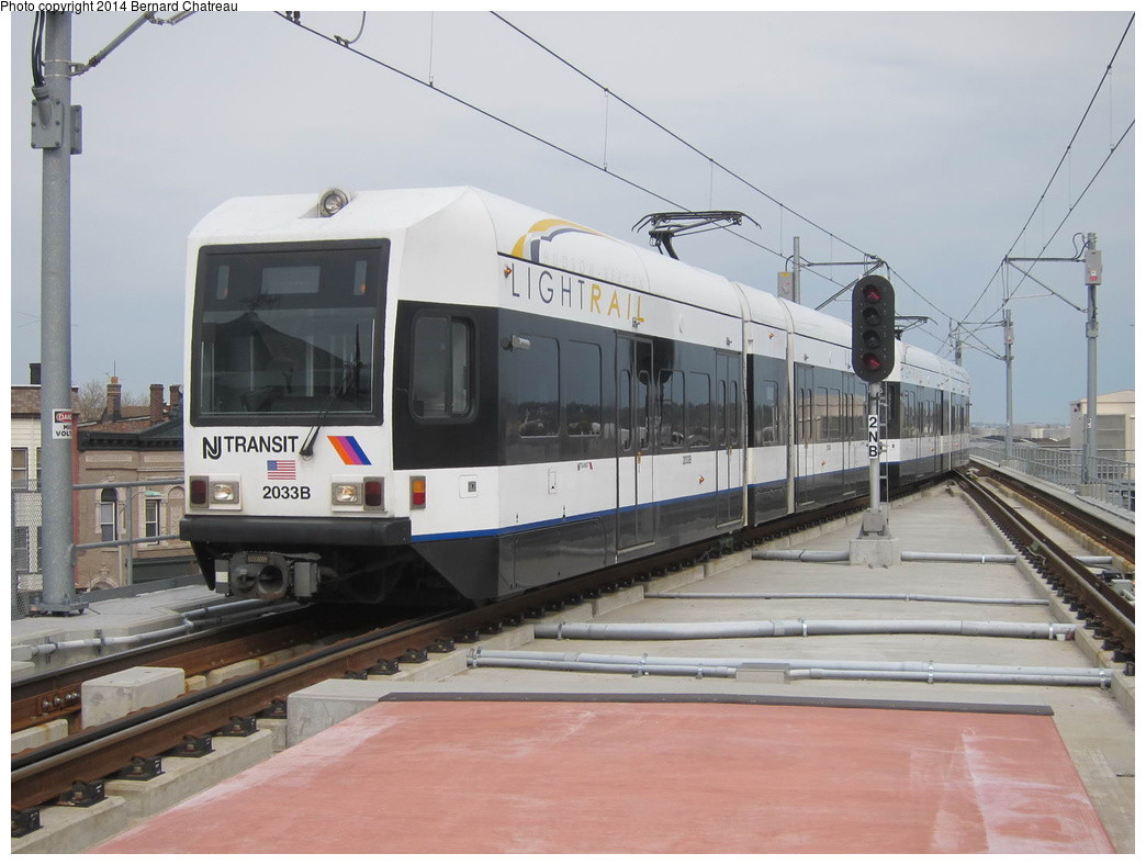 (254k, 1044x788)<br><b>Country:</b> United States<br><b>City:</b> Jersey City, NJ<br><b>System:</b> Hudson Bergen Light Rail<br><b>Location:</b> Bayonne 8th Street<br><b>Car:</b> NJT-HBLR LRV (Kinki-Sharyo, 1998-99) 2033 <br><b>Photo by:</b> Bernard Chatreau<br><b>Date:</b> 4/18/2011<br><b>Viewed (this week/total):</b> 0 / 483