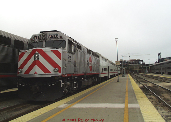 (112k, 720x516)<br><b>Country:</b> United States<br><b>City:</b> San Francisco/Bay Area, CA<br><b>System:</b> Caltrain (SF Bay)<br><b>Location:</b> San Francisco (4th & King)<br><b>Car:</b> Caltrain F40PH-2CAT (EMD, 1985) 916 <br><b>Photo by:</b> Peter Ehrlich<br><b>Date:</b> 8/2/2001<br><b>Notes:</b> Faced with a ridership spurt, Caltrain leased several ex-Metra (C&NW) gallery cars for a time.<br><b>Viewed (this week/total):</b> 0 / 3175