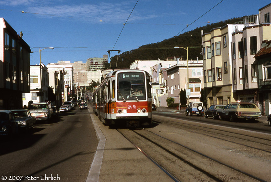 (199k, 864x581)<br><b>Country:</b> United States<br><b>City:</b> San Francisco/Bay Area, CA<br><b>System:</b> SF MUNI<br><b>Line:</b> MUNI Metro (N-Judah)<br><b>Location:</b> Judah/12th<br><b>Car:</b> MUNI Standard LRV (Boeing-Vertol, 1976-78) 1257 <br><b>Photo by:</b> Peter Ehrlich<br><b>Date:</b> 5/29/1990<br><b>Notes:</b> Approaching Judah/12th Avenue outbound.<br><b>Viewed (this week/total):</b> 0 / 914